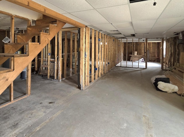 2401 Schippers Ln, Kalamazoo, MI 49048 - unfinished basement with a paneled ceiling and stairway