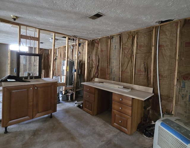2401 Schippers Ln, Kalamazoo, MI 49048 - bathroom with visible vents, water heater, a textured ceiling, and vanity