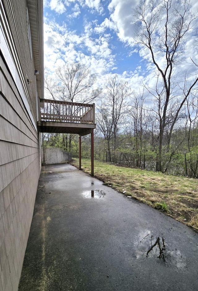2401 Schippers Ln, Kalamazoo, MI 49048 - view of patio with aphalt driveway and a deck