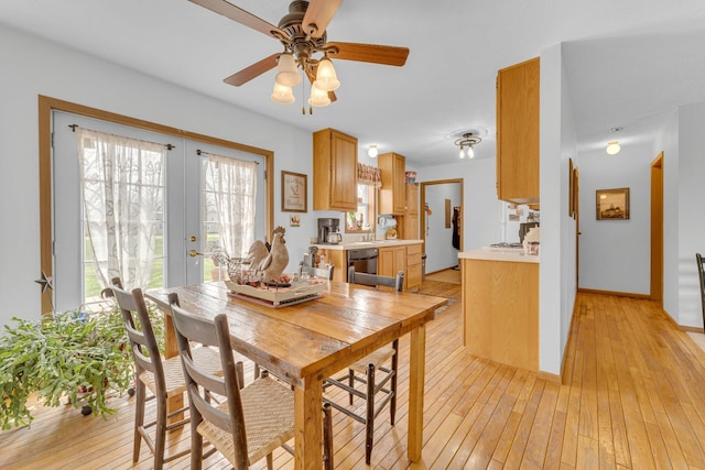 110 Dayton St, Homer, MI 49245 - dining room with french doors, a ceiling fan, baseboards, and light wood-style floors
