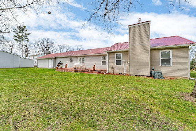 110 Dayton St, Homer, MI 49245 - rear view of property with a wooden deck, a lawn, and a chimney