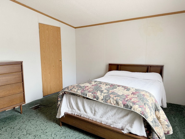carpeted bedroom featuring visible vents and crown molding