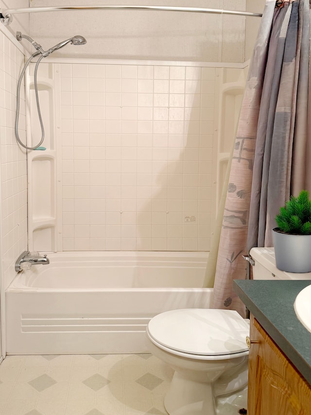 bathroom featuring shower / bath combo, toilet, and vanity