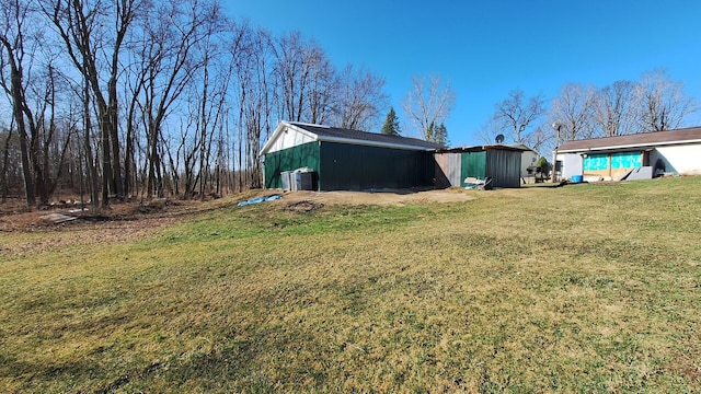 exterior space featuring a pole building and an outbuilding