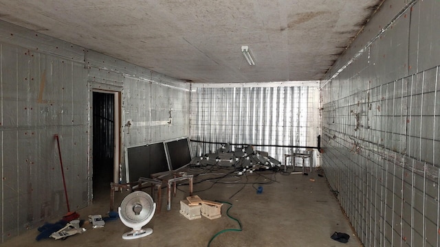 spare room with concrete floors