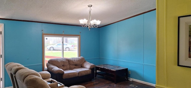 living room with visible vents, a chandelier, a textured ceiling, and dark wood-type flooring