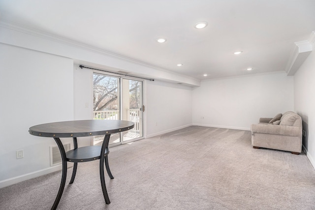 unfurnished room featuring baseboards, ornamental molding, and light colored carpet