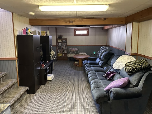 living room featuring wallpapered walls, a wainscoted wall, and carpet