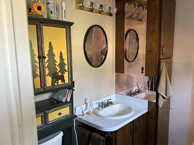 bathroom featuring toilet and vanity