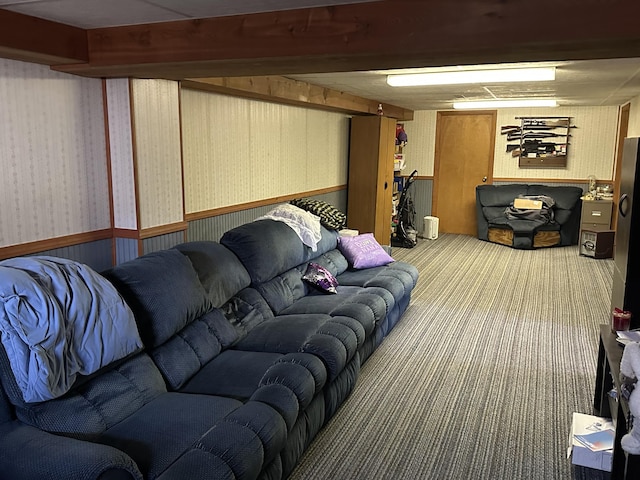 carpeted living area featuring wainscoting and wallpapered walls