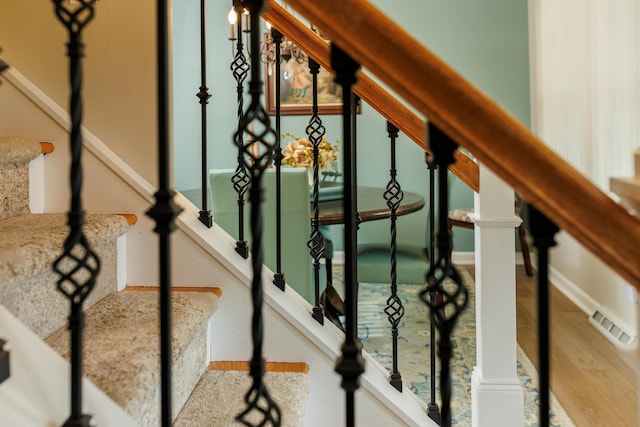 11630 Mcclumpha Rd, Plymouth, MI 48170 - stairway featuring baseboards, visible vents, and wood finished floors