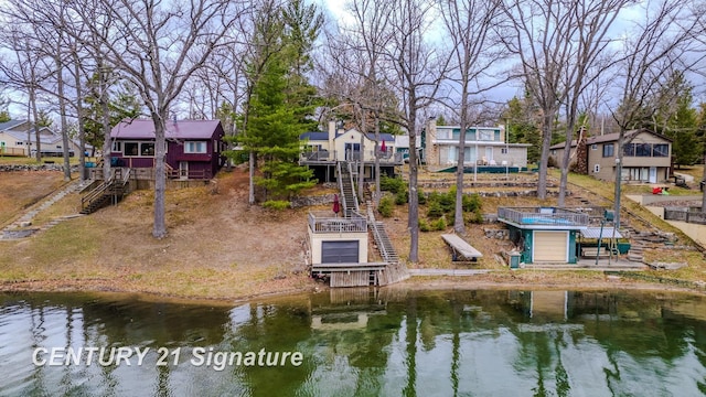 7765 Nicole Dr, South Branch, MI 48761 - view of home's community featuring a residential view, stairs, and a deck with water view