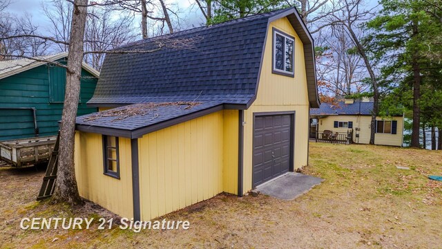 7765 Nicole Dr, South Branch, MI 48761 - garage featuring driveway and a garage