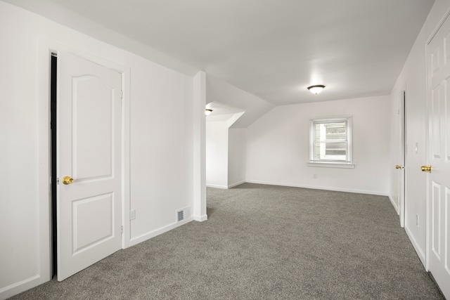 15100 Washburn St, Detroit, MI 48238 - additional living space with vaulted ceiling, carpet floors, baseboards, and visible vents