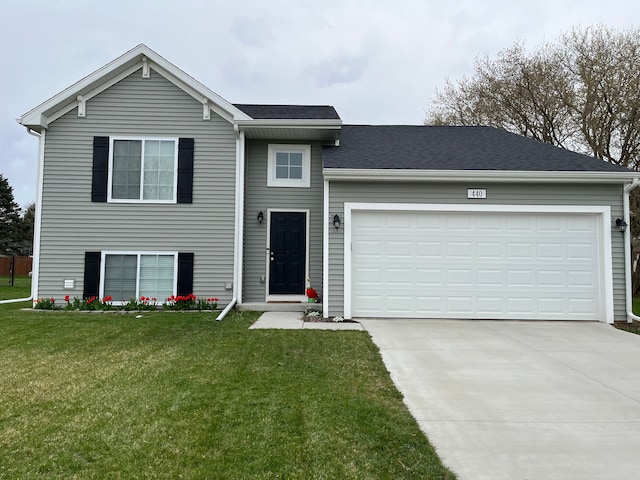 split level home featuring concrete driveway, a garage, roof with shingles, and a front lawn