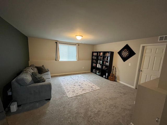 living area with visible vents, baseboards, and carpet floors