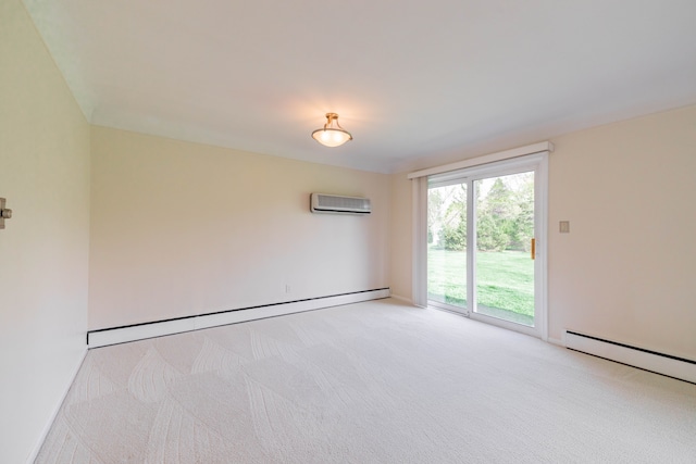 spare room featuring a baseboard heating unit, a wall unit AC, and light carpet