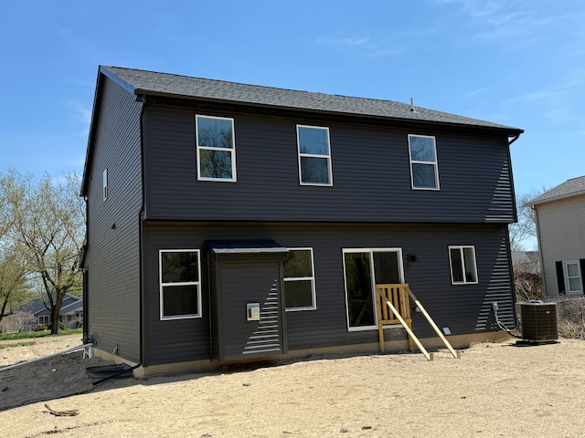 back of property featuring cooling unit