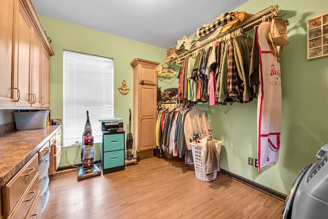 spacious closet with light wood-style floors