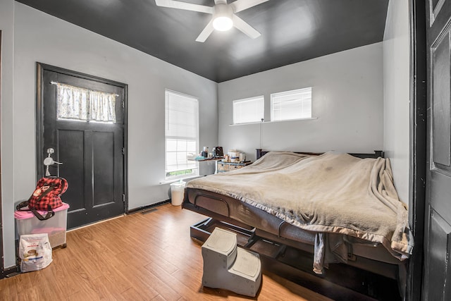 bedroom with ceiling fan and light wood finished floors