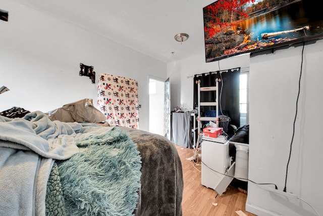bedroom with light wood-style flooring