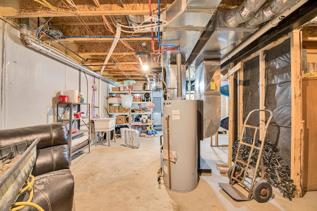 unfinished below grade area featuring a sink and gas water heater