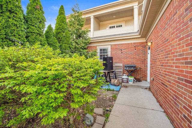 exterior space featuring brick siding