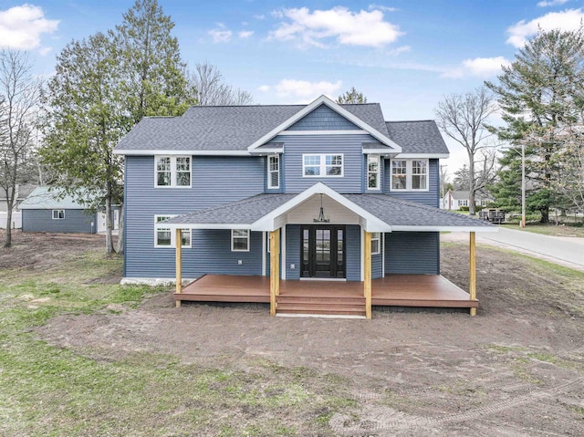 view of front of home with a shingled roof