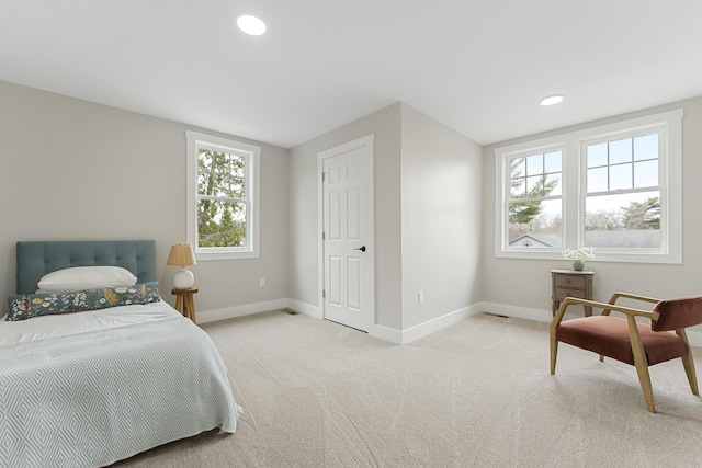 bedroom featuring baseboards, recessed lighting, and light colored carpet