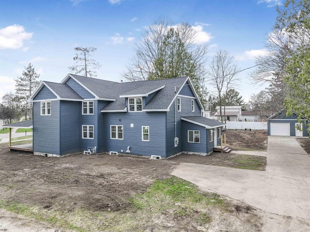 exterior space featuring a shingled roof and driveway