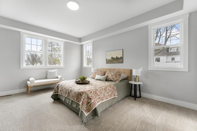 carpeted bedroom with baseboards