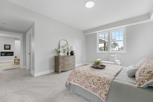carpeted bedroom with baseboards