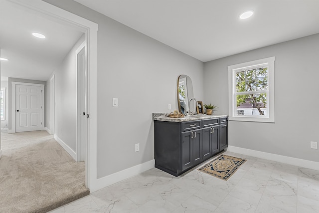 bar featuring recessed lighting, marble finish floor, and baseboards