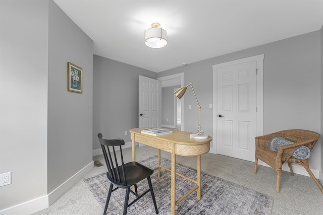 home office with light carpet and baseboards