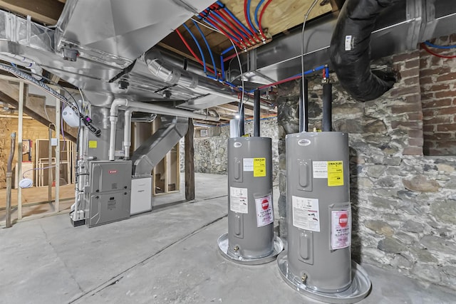utility room featuring heating unit and electric water heater