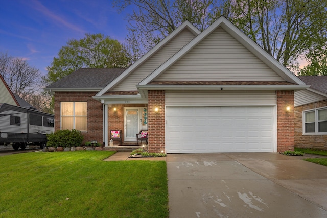 view of front of property featuring brick siding, concrete driveway, an attached garage, a front lawn, and a shingled roof