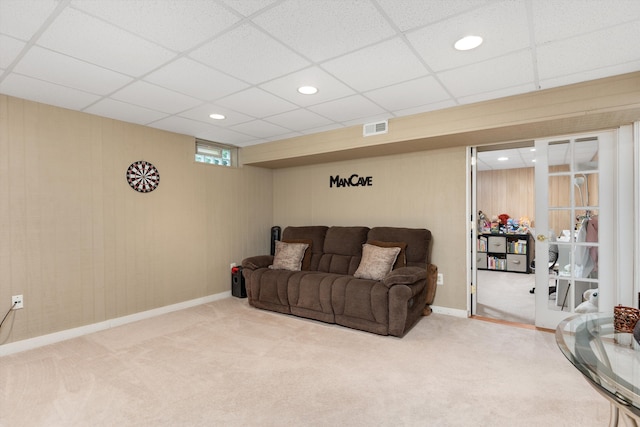 living area with carpet, recessed lighting, a paneled ceiling, and baseboards