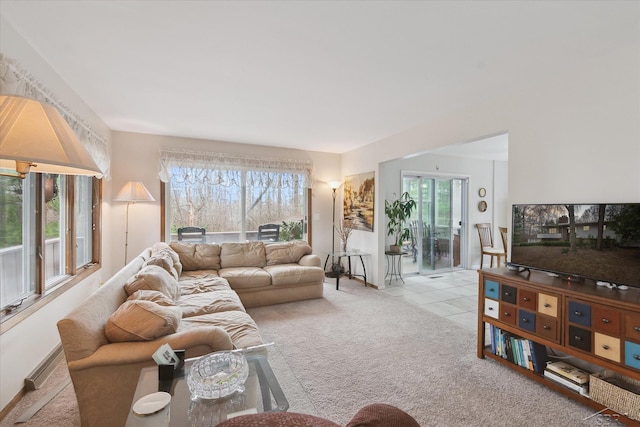 living room with tile patterned flooring and carpet flooring