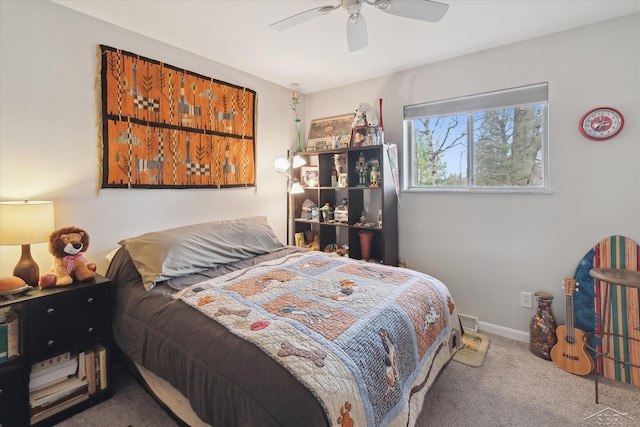 carpeted bedroom featuring baseboards and a ceiling fan
