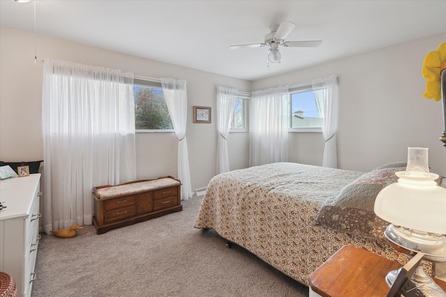 bedroom featuring ceiling fan and light carpet