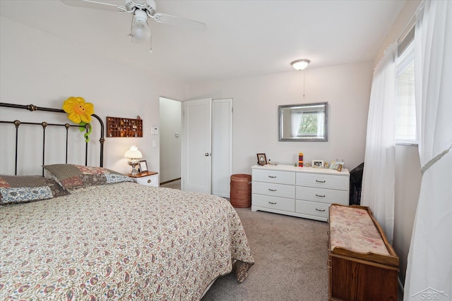 carpeted bedroom with a ceiling fan
