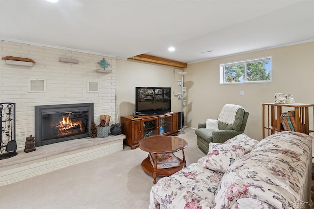 carpeted living room with ornamental molding, recessed lighting, visible vents, and a fireplace