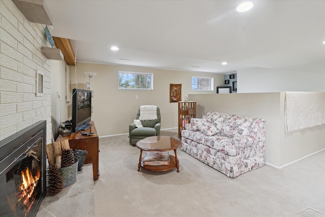 living room featuring recessed lighting, baseboards, carpet floors, and a fireplace