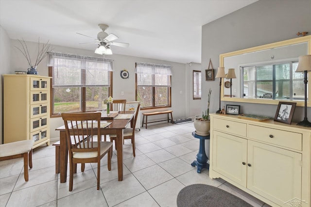 dining area featuring a wealth of natural light, a ceiling fan, and light tile patterned floors