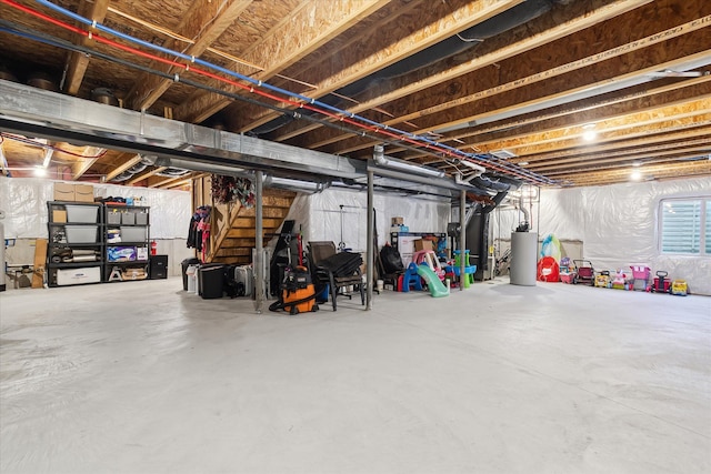 unfinished basement with water heater, heating unit, and stairway