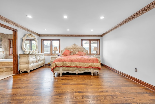 bedroom with baseboards, recessed lighting, wood finished floors, and crown molding