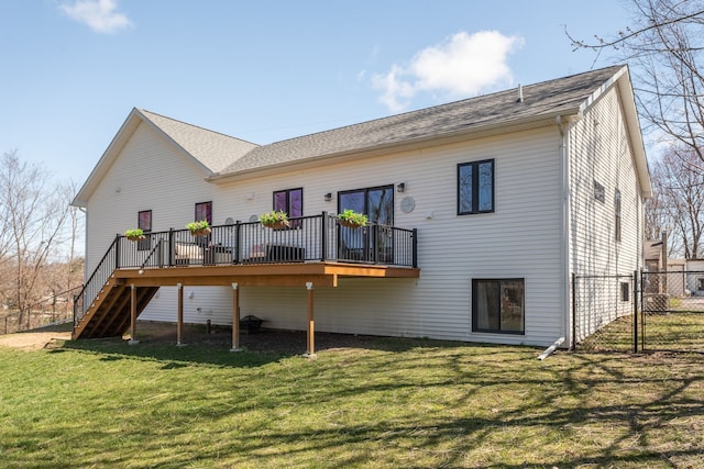 back of house featuring stairway, a yard, a gate, a deck, and fence