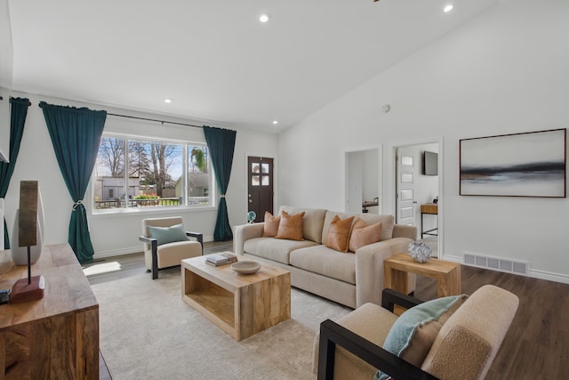 living area featuring visible vents, recessed lighting, and light wood finished floors
