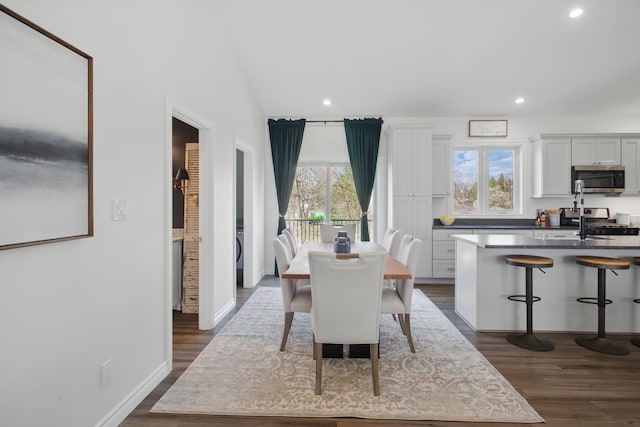 dining area featuring plenty of natural light, recessed lighting, and dark wood finished floors