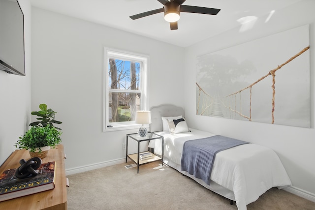bedroom with baseboards, a ceiling fan, and carpet floors